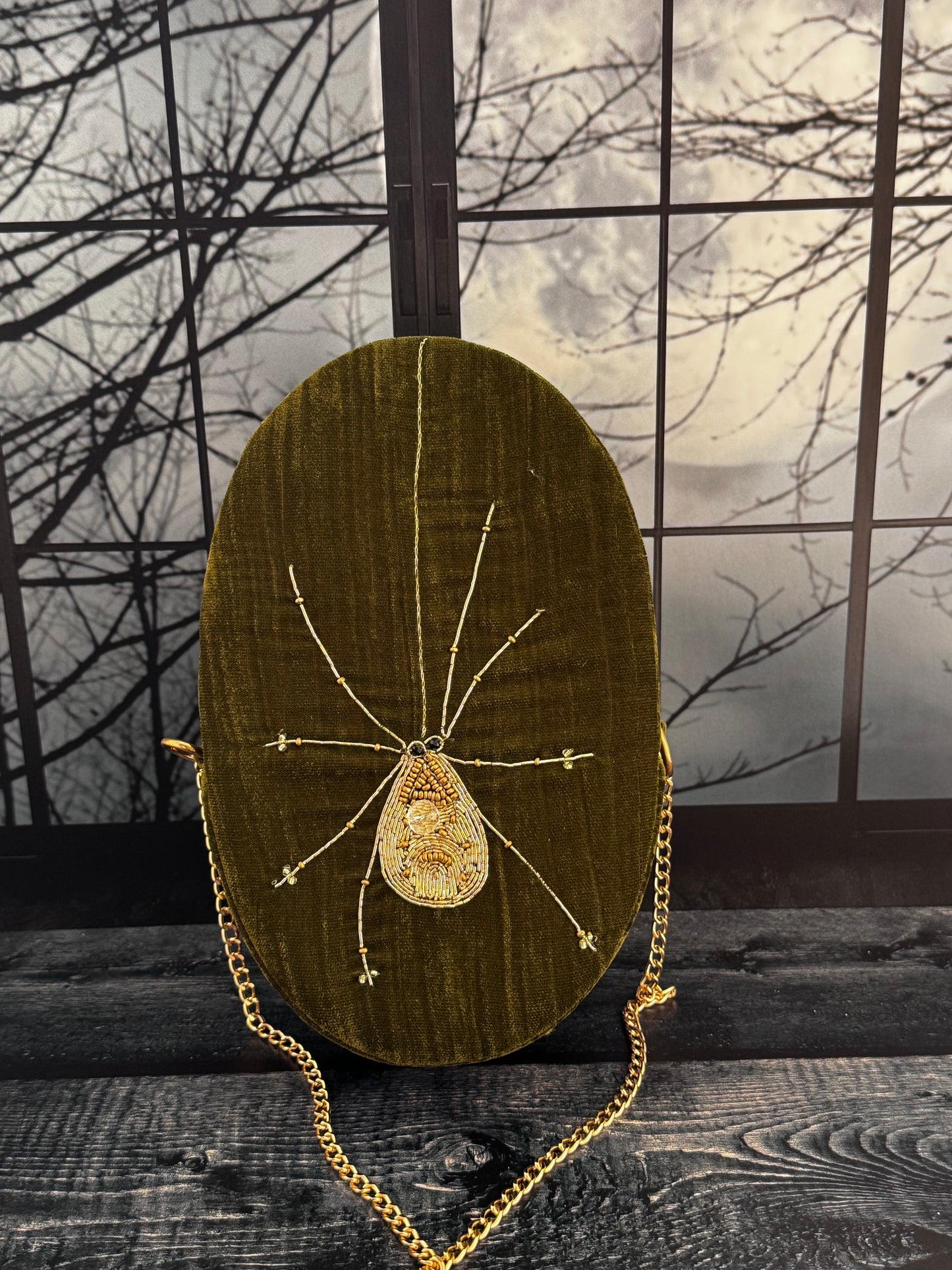 Moss & Moonlight forest green velvet purse, back view with hand embellished gold spider