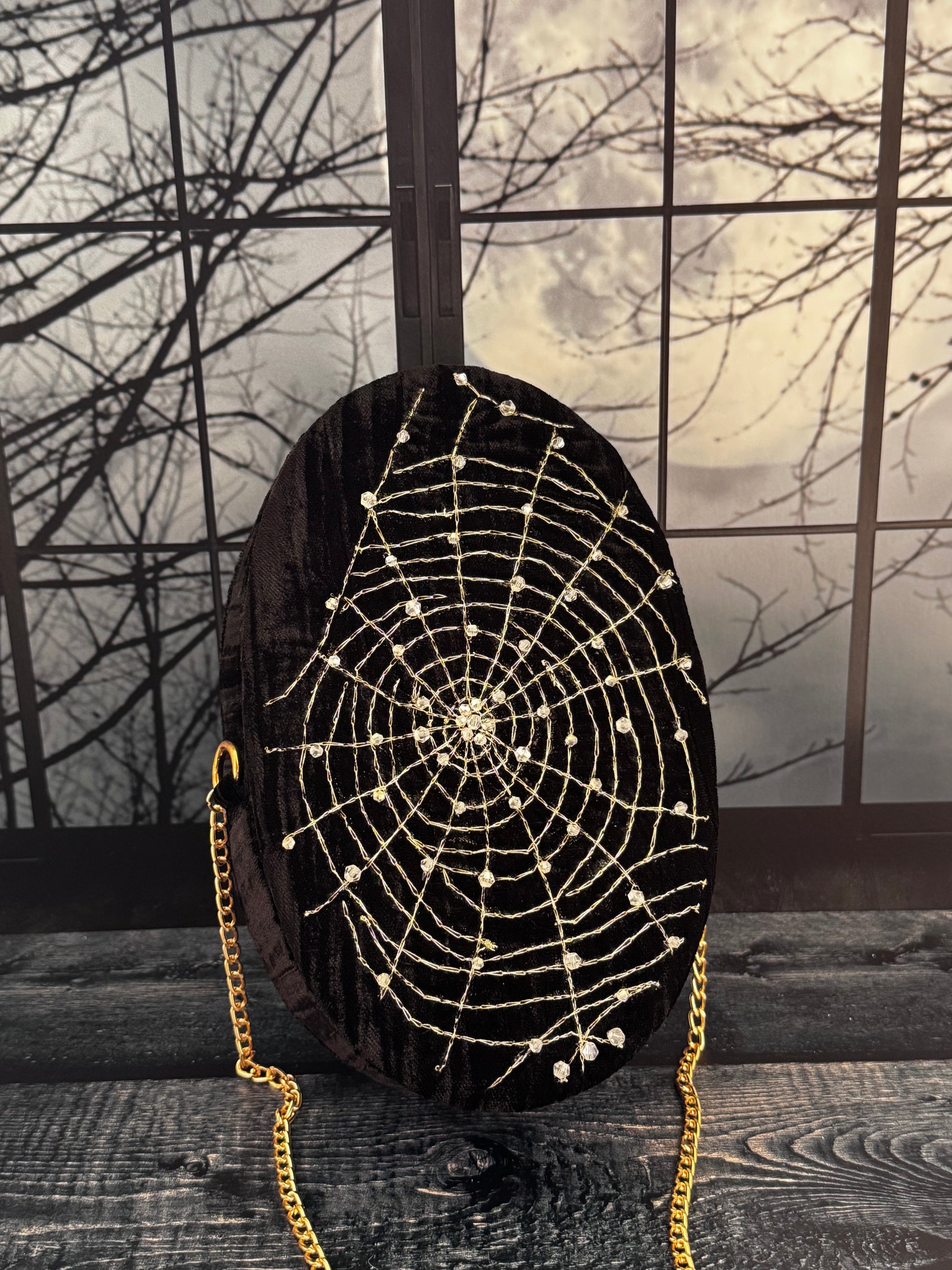 Midnight Spell black velvet purse, front view with hand embellished gold spiderweb and chain strap