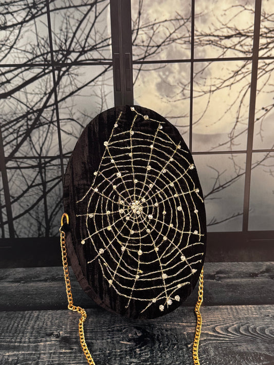 Midnight Spell black velvet purse, front view with hand embellished gold spiderweb and chain strap