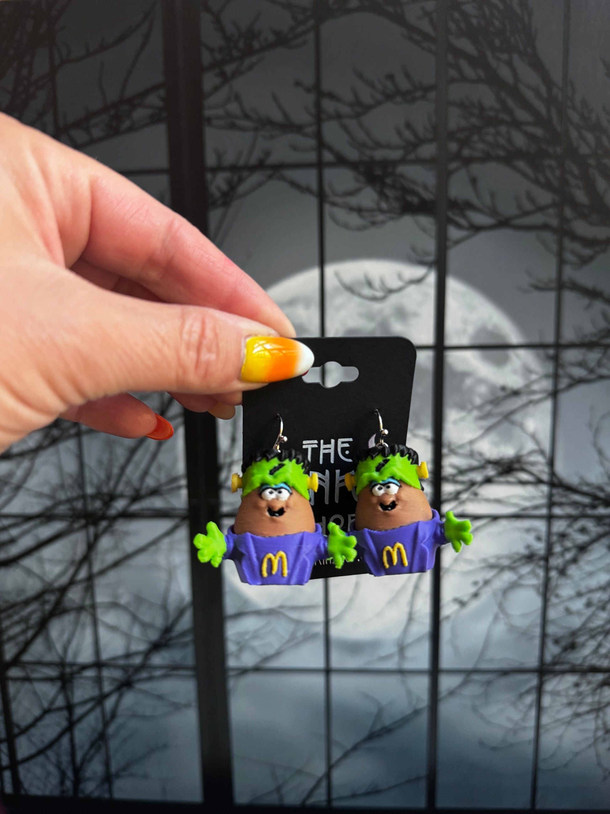Handmade Frankenstein nugget buddy dangle earrings with green flat top hair, green arms and a purple outfit